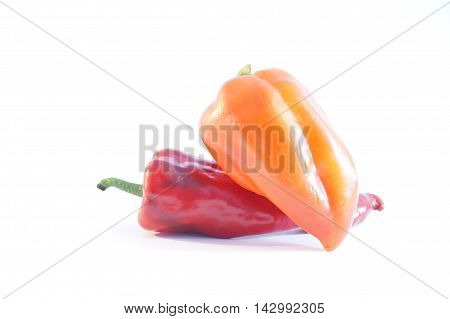 Red hot and sweet peppers isolated on white batskground