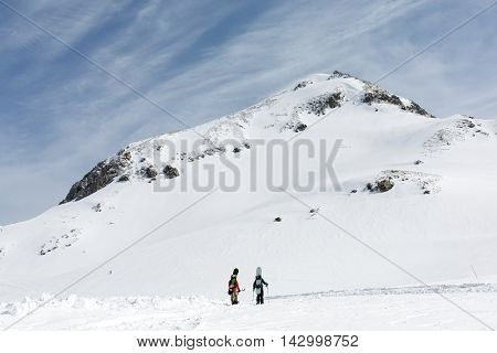 Skiers walking on snow covered mountain ranges Tateyama Japan