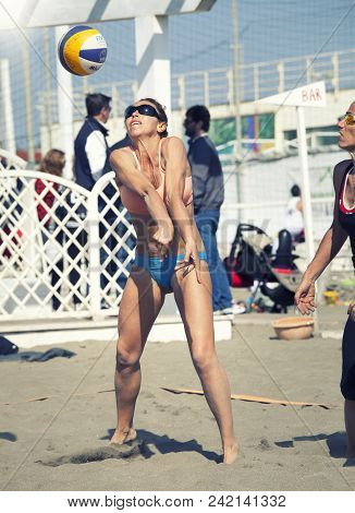 Ostia, Italy. May 12, 2015: Woman Serve Receive The Ball During A Beachvolley Match Between Friends 