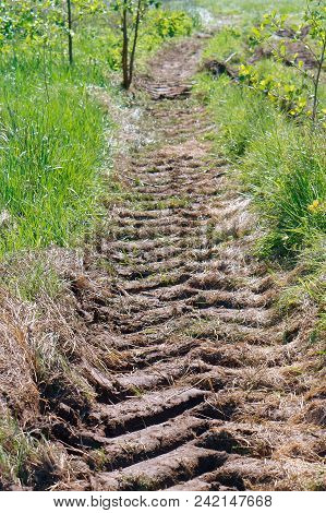 A Tractor Track, The Trace Of The Tractor On The Ground, Even The Tread In The Ground