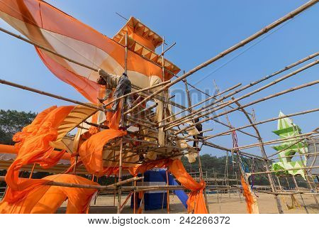 Kolkata, West Bengal, India - January 18th 2015 : Unknown Labour Dismantling A Pandal (a Temporary S