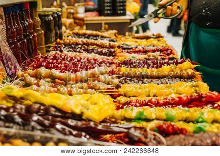 Multicolored Churchhel Lying In The Market, An Oriental Dessert Of Grapes And Nuts