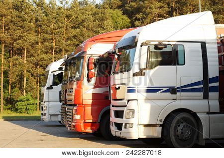 Trucks Lit By The Setting Sun. Rest Area (rest Stop).