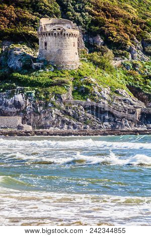 Mediterranean Sea And Historic Sixteenth Century Tower. An Ancient Defense Tower On A Mountain On Th