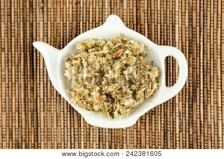 Dried Mullein Leaf Tea On A Wood Background