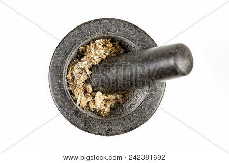 Dried Mullein Leaf Tea In A Mortar And Pestle Isolated On A White Background