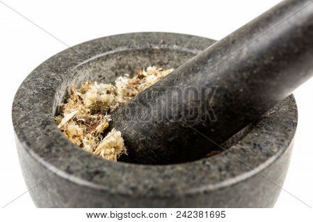 Dried Mullein Leaf Tea In A Mortar And Pestle Isolated On A White Background