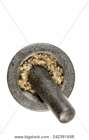 Dried Mullein Leaf Tea In A Mortar And Pestle Isolated On A White Background