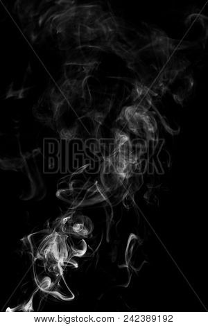 Movement Of White Smoke Isolated On Black Background.