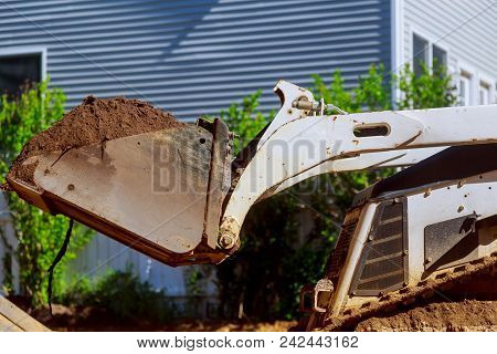 Front End Loader Bulldozer Earth Mover Working In A Newconstruction