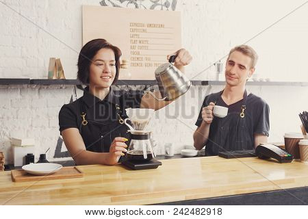 Coffee Business Background With Copy Space. Portrait Of Two Young Bartenders Preparing Fresh Pourove