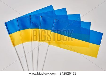Gathering Of Ukrainian Flags. Many Ukraine Flags On White Isolated Background.