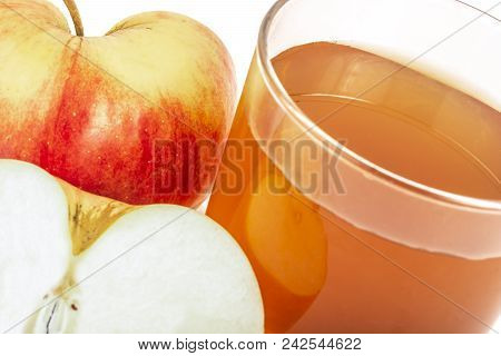 Apple Juice In Glass And Fresh Apples On White Background