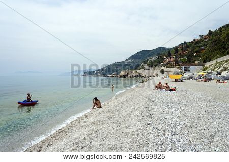 Varigotti, Liguria, Italy - May 21, 2009: Varigotti Beach With Pebbles In Liguria, Italy With People