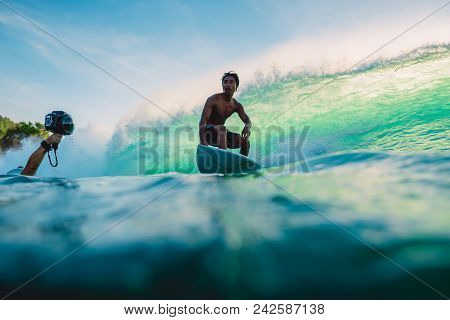 April 23, 2018. Bali, Indonesia. Surfer Ride On Big Barrel Wave At Padang Padang. Professional Surfi