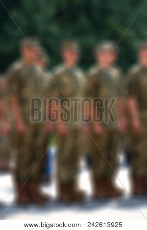 Armed Soldiers Blur Background With Bokeh (motion Blur).