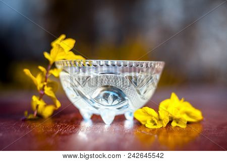 Mint Water With Raw Organic Leaves Of Mint On Brown Wooden Surface.