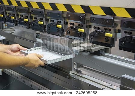 The Technician Operator Handing The Sheet Metal Part With  Hydraulic Bending Machine. Metal Working 