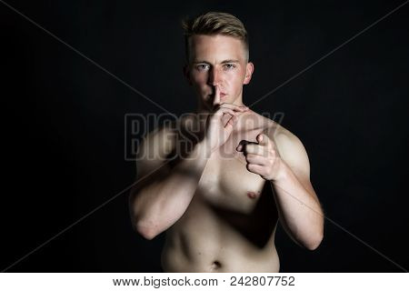 Keep Silence. Attractive Guy. Shhhh. Man Asks For Silence. Black Background.