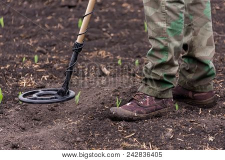 Man To Seek Treasure On Earth With A Metal Detector, Walks The Field, Squeak Gold