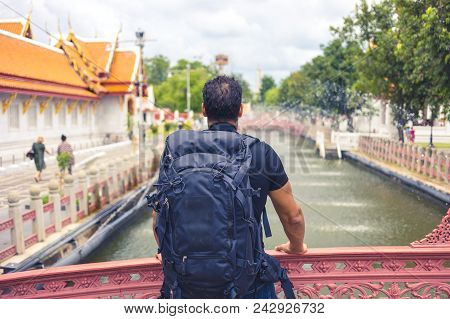Man Backpacher Visiting Asia During A Sunny Day , Solo Trip , Holiday And Vacations Concept .