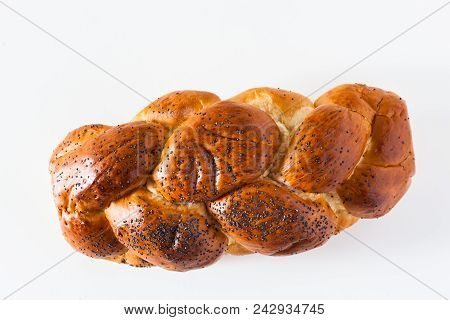 Braided Bread Sprinkled With Poppy Seeds, Isolated On White. Cop