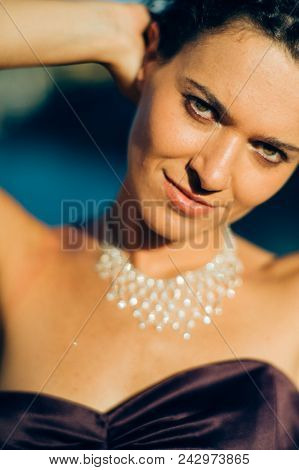 Young Cute Brunette Portrait Posing At Sunset