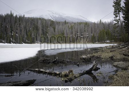 Winter At An Alpine Lake In The Colorado Rockies.