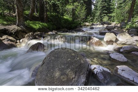 Colorado Flowing Creek High In The Rocky Mountains.