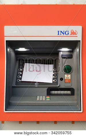 The Hague, Netherlands - December 25, 2019: Cash machine from the ING bank with a written note the word empty
