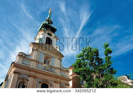 Tower Of Stiftskirche Church On Mariahilfer Strasse In Vienna