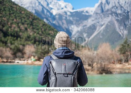 Young Man Traveler Traveling At Blue Moon Valley, Landmark And Popular Spot Inside The Jade Dragon S