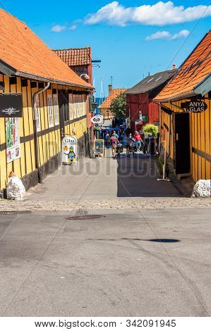 Svaneke, Bornholm, Denmark - June 2018. People Walking In The Small Streets.