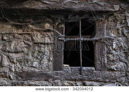 Window With Cobwebs. Popular Architecture In The Historic Village Of La Alberca. Salamanca. Spain.