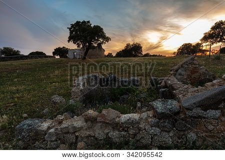 Sunset Landscape With Old Ruins Near Arroyo De La Luz. Extremadura. Spain.