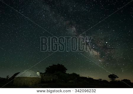 Night Landscape With Milky Way In The Natural Park Of Barruecos. Extremadura. Spain.