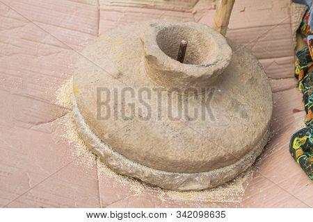 Close Up Of A Ancient Stone Grinder In A House. Traditional Wheat And Grain Grinder Used To Grind Gr