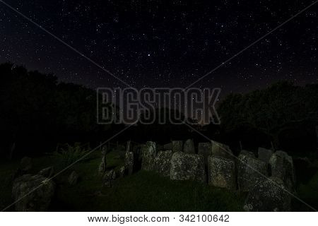Dolmen Of The Great Oak. Night Landscape With Ancient Prehistoric Dolmen. Montehermoso. Extremadura.