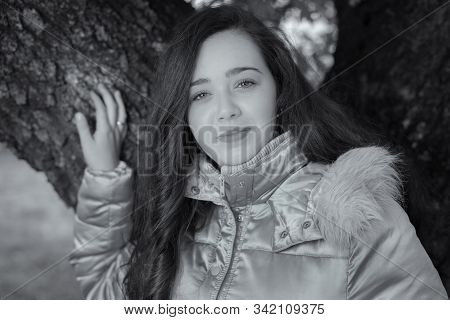 Portrait Of Beautiful Young Woman In The Field.