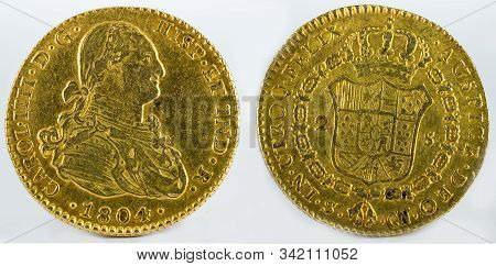 Ancient Spanish Gold Coin Of King Carlos Iv. With A Value Of 2 Escudos And Minted In Seville. 1804.