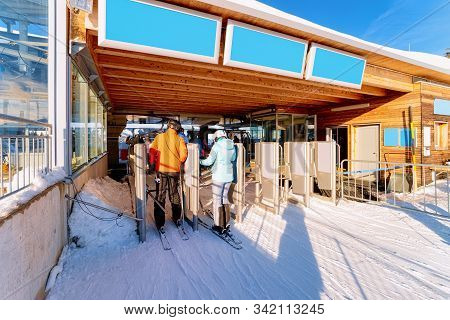 People On Ski At Ticket Gate In Penkenbahn Station Austria
