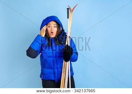 Skii Lover. Caucasian Womans Portrait On Blue Studio Background. Beautiful Female Model In Warm Clot