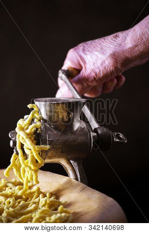 Making Italian Traditional Handmade And Homemade Passatelli Pasta - Typical Food From Modena And Bol