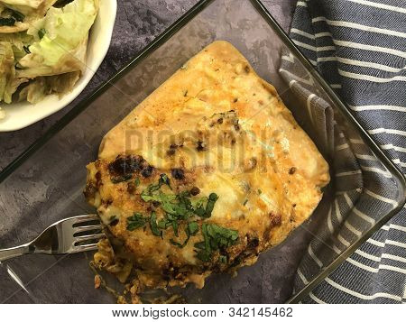 Lasagna Al Forno With Sauce Bolognese And Salad.