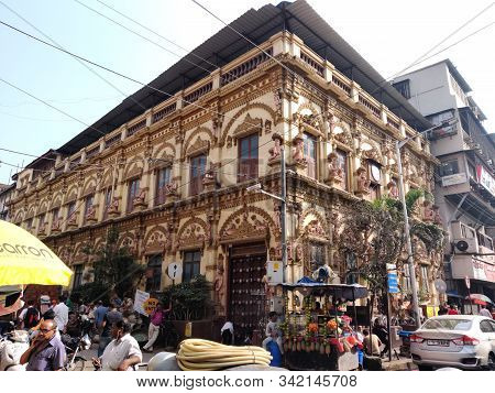 Mumbai, India - April, 2017: Cityscape Of Mumbai With Traffic Jam At The Road And People Walking Aro