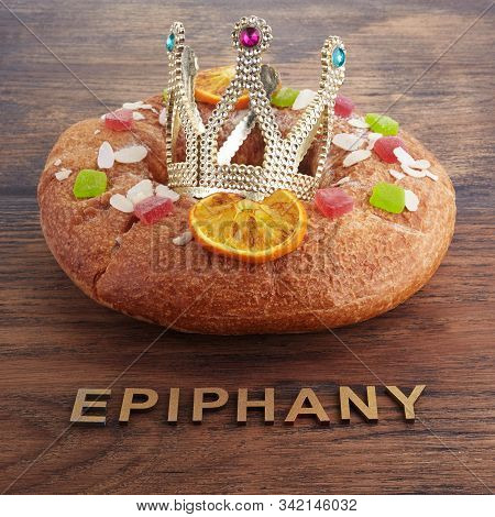 Epiphany Cake, Kings Cake, Roscon De Reyes Or Rosca De Reyes On Wooden Table
