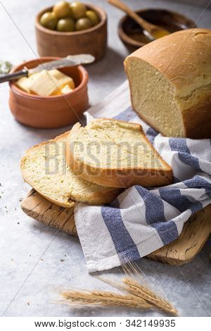 Fresh Homemade Crisp Bread With Olive Oil, Butter And Green Olives, Top View.  Baking Concept. Bread