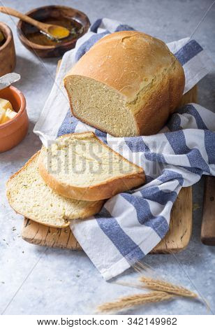 Fresh Homemade Crisp Bread  And Slices With Olive Oil, Butter And Green Olives, Top View.  Baking Co