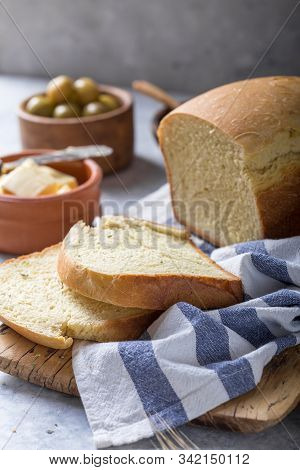 Fresh Homemade Crisp Bread With Olive Oil, Butter And Green Olives, Top View.  Baking Concept. Bread