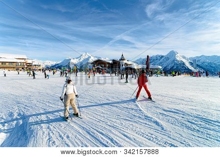People Skier Skiing In Ski Resort Penken Park Of Austria